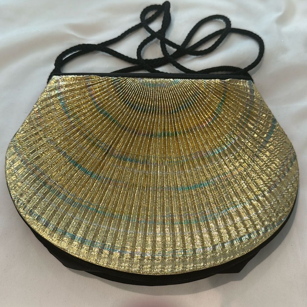 Gold/Black Clutch bag. Front shell design